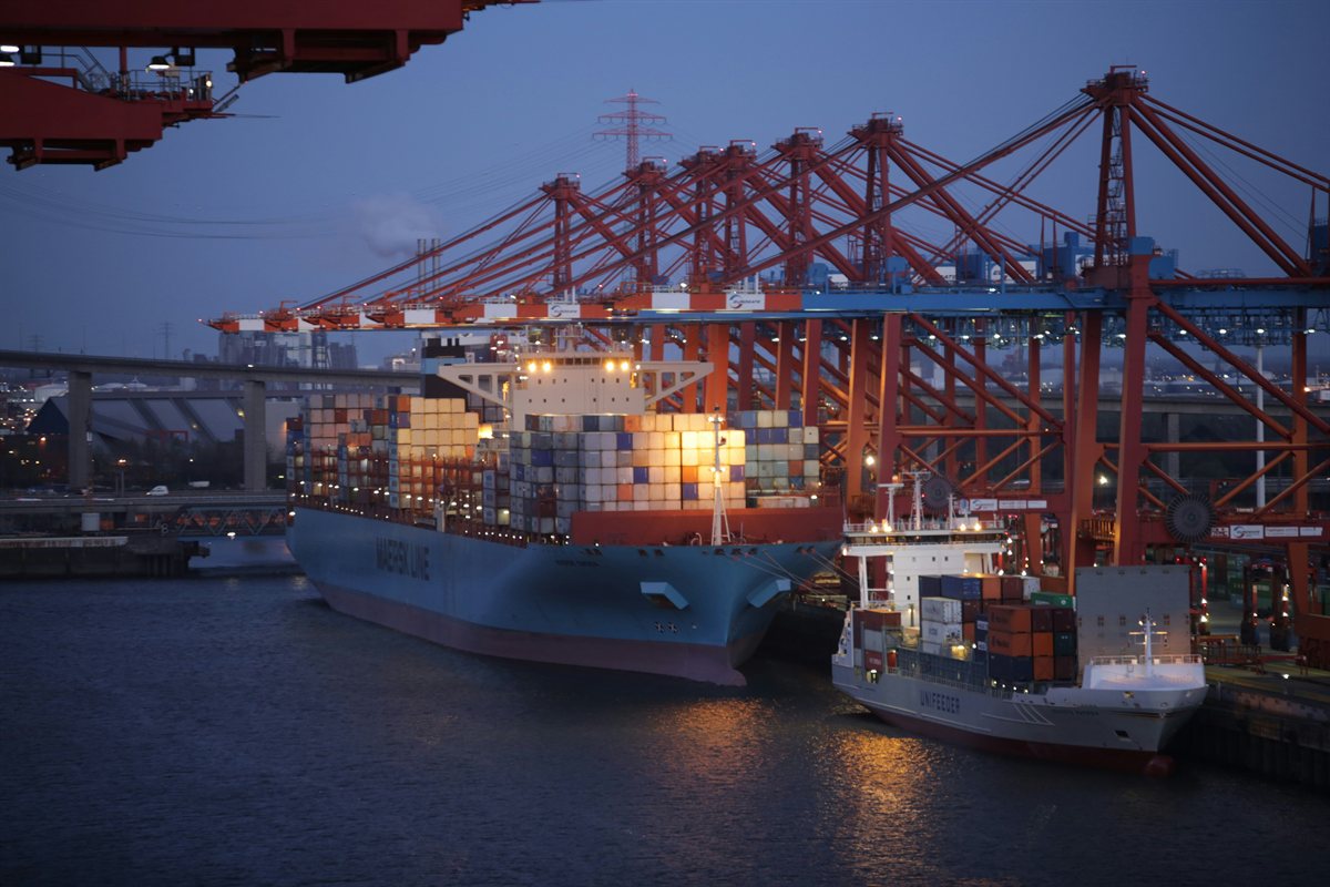 Modern maritime shipping harbor at dusk